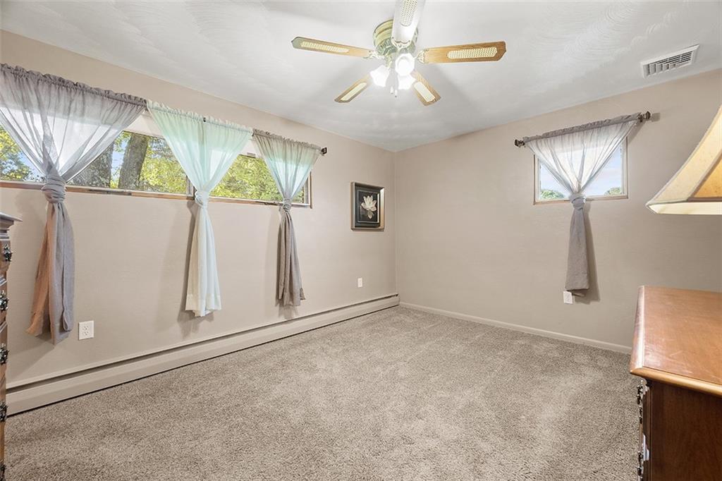 632 Sandy Hill Road Valencia, PA 16059 - Photo 20 of 48 an empty room with windows and fan