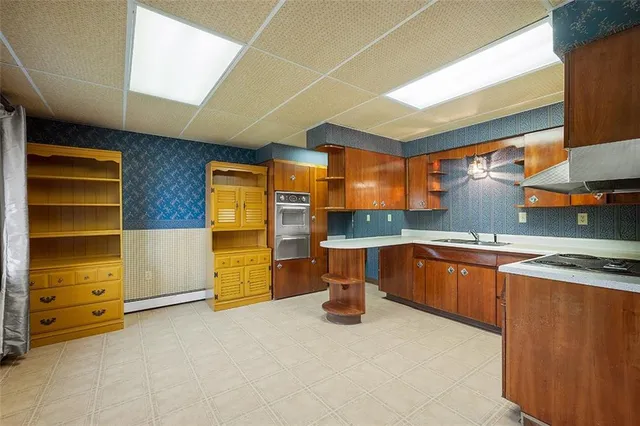 a kitchen with a sink and a stove