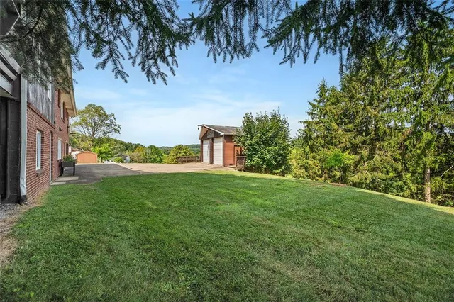 a backyard of a house with lots of green space