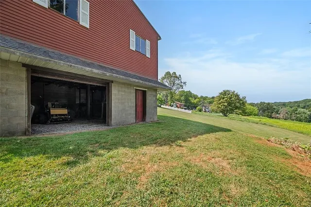 a view of a house with backyard porch and garden
