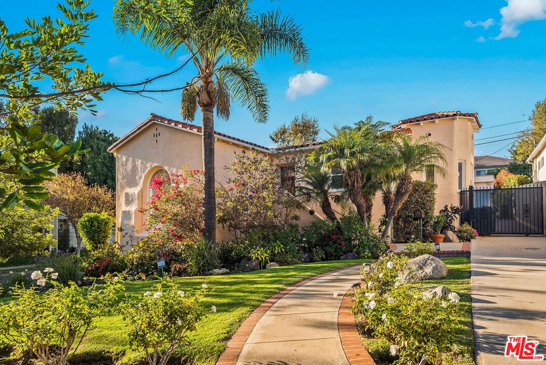 10497 Kinnard Avenue Los Angeles, CA 90024 - Photo 1 of 19 a front view of a house with a yard