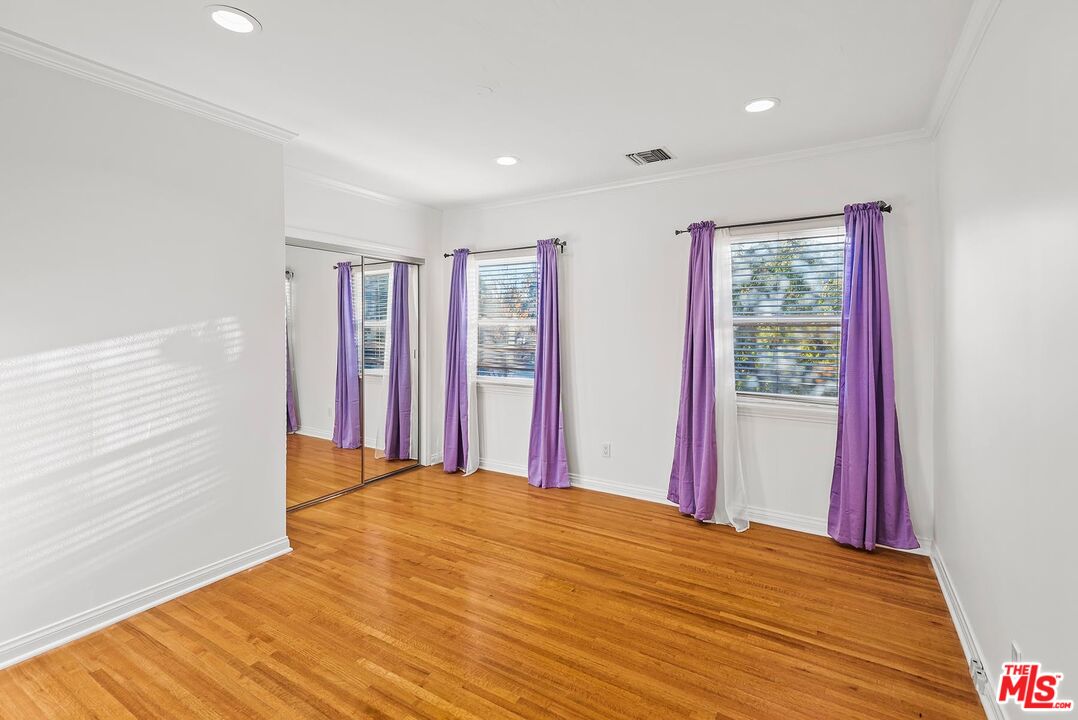10497 Kinnard Avenue Los Angeles, CA 90024 - Photo 11 of 19 a view of a room with wooden floor and windows