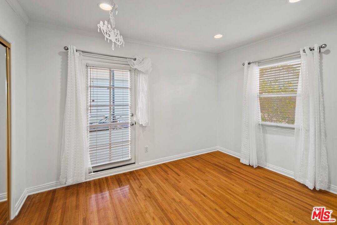 10497 Kinnard Avenue Los Angeles, CA 90024 - Photo 15 of 19 a view of empty room with wooden floor and fan
