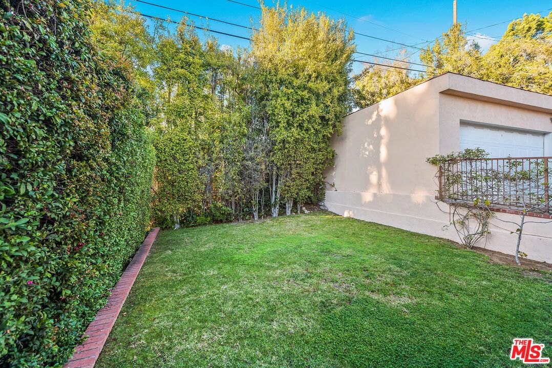 10497 Kinnard Avenue Los Angeles, CA 90024 - Photo 18 of 19 a view of a backyard with potted plants