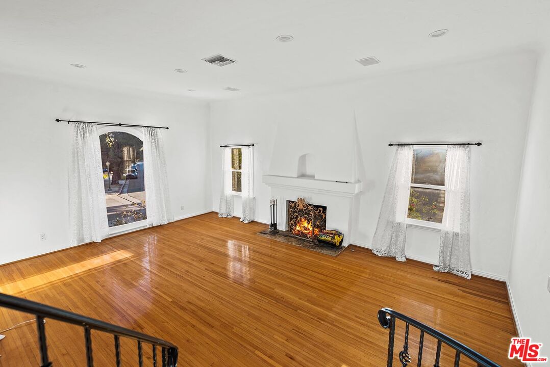 10497 Kinnard Avenue Los Angeles, CA 90024 - Photo 2 of 19 a bed room with a bed and a chair