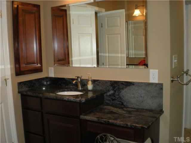 3417 Hackney Court Raleigh, NC 27613 - Photo 13 of 23 View of "her" marble vanity with sitting area & extra cabinetry. This bath has all the bells & whistles. Master Bath/Spa