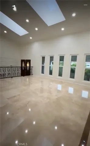 a view of an empty room with windows