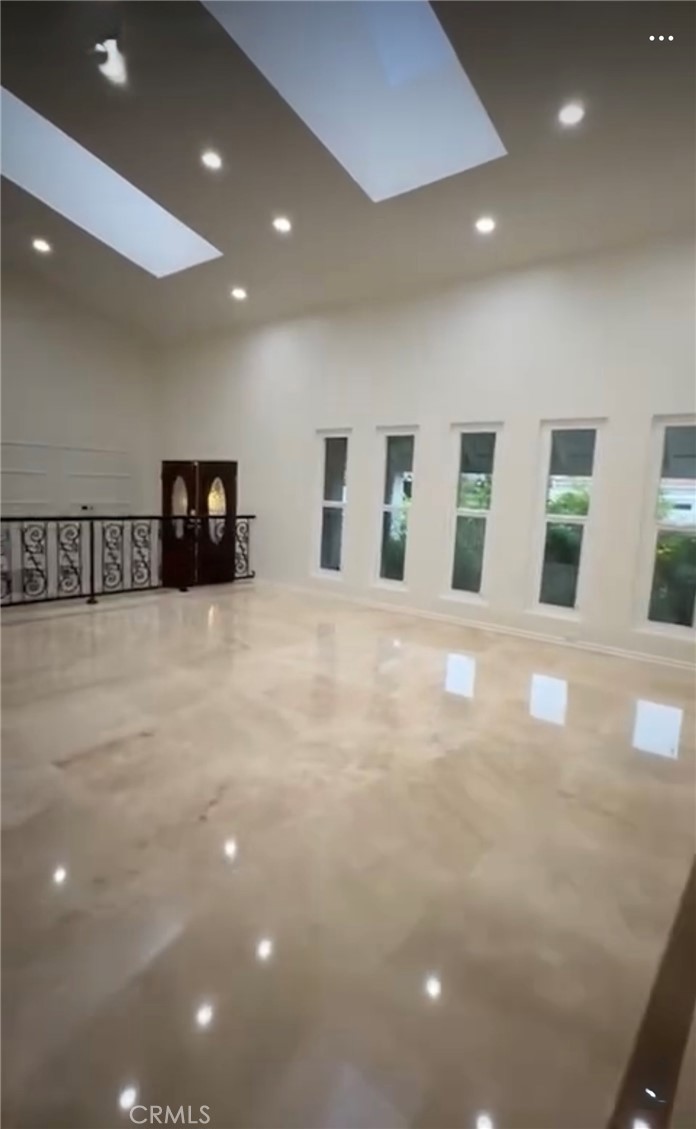 a view of an empty room with windows