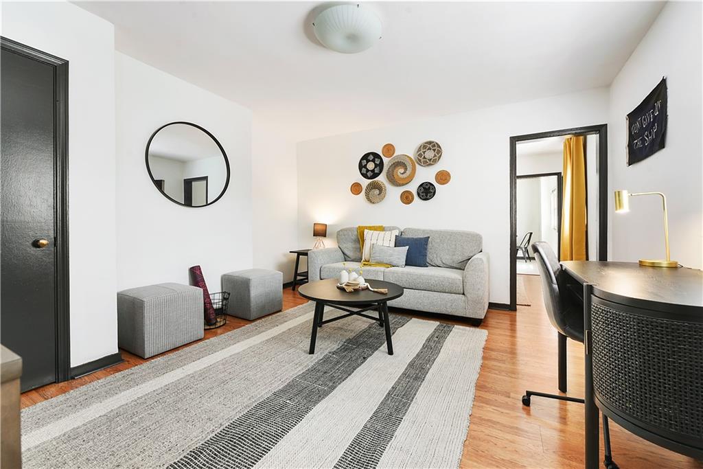 3800 Butler Street Pittsburgh, PA 15201 - Photo 15 of 21 a living room with furniture and a wooden floor