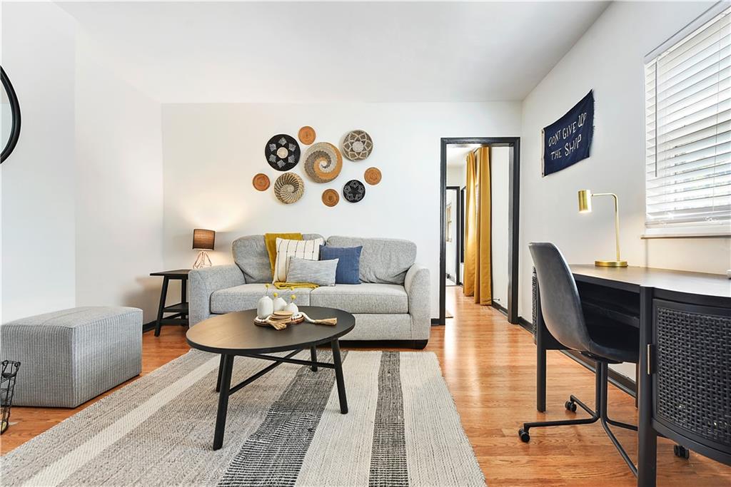 3800 Butler Street Pittsburgh, PA 15201 - Photo 16 of 21 a living room with furniture and wooden floor