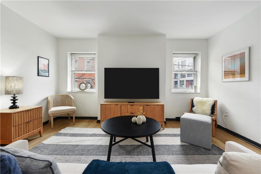 3800 Butler Street Pittsburgh, PA 15201 - Photo 3 of 21 a living room with furniture and a flat screen tv