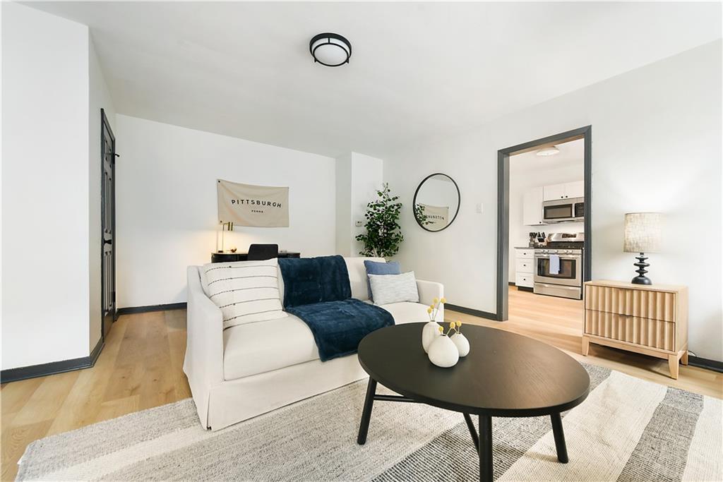 3800 Butler Street Pittsburgh, PA 15201 - Photo 5 of 21 a living room with furniture a rug and a window