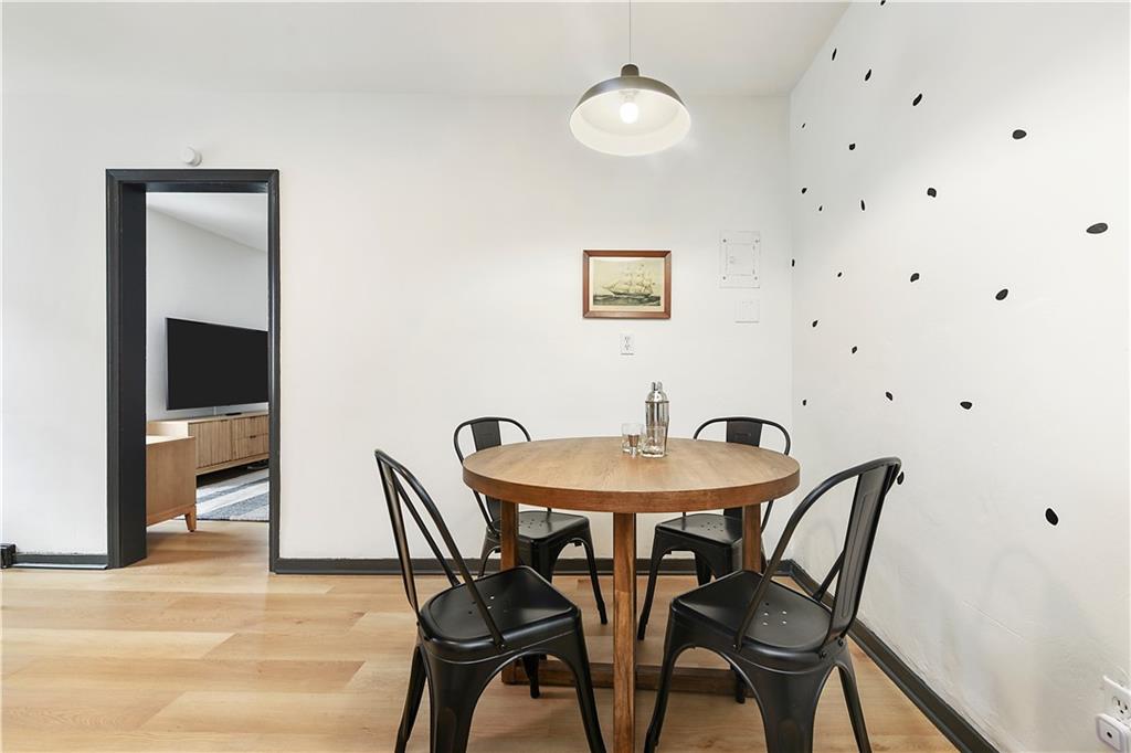 3800 Butler Street Pittsburgh, PA 15201 - Photo 7 of 21 a view of a dining room with furniture and wooden floor