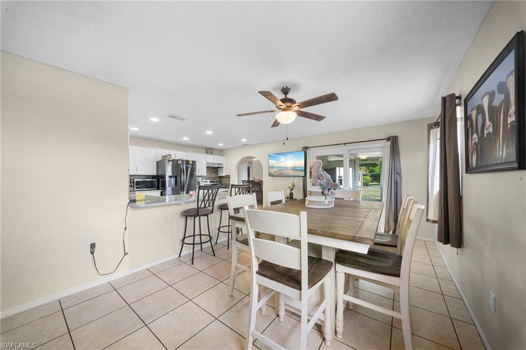 7289 Barragan Road Fort Myers, FL 33967 - Photo 9 of 18 Open-concept dining area with tile flooring and a ceiling fan
