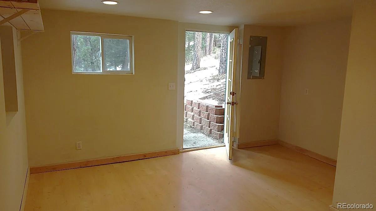 5091 South Olive Road Evergreen, CO 80439 - Photo 17 of 23 an empty room with windows