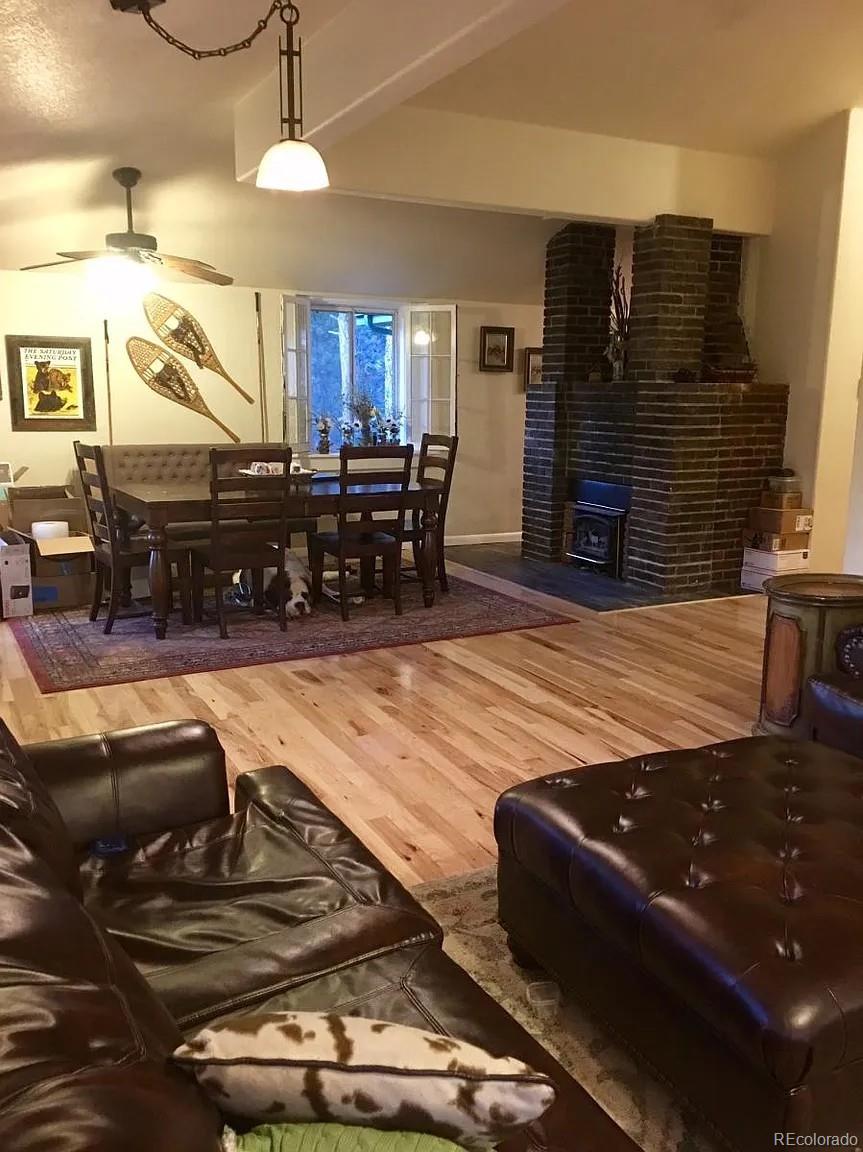 5091 South Olive Road Evergreen, CO 80439 - Photo 5 of 23 a living room with furniture