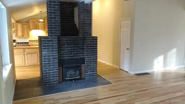a view of hallway with wooden floor