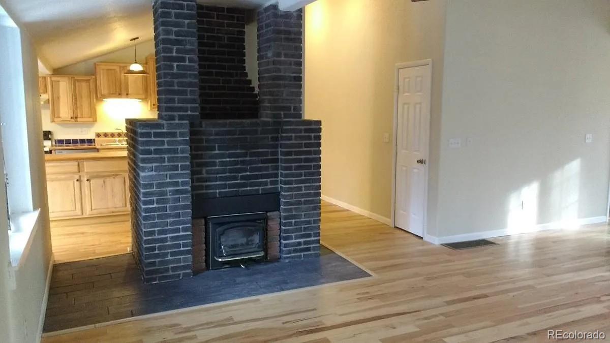5091 South Olive Road Evergreen, CO 80439 - Photo 7 of 23 a view of hallway with wooden floor