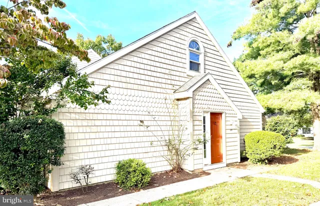 a view of a house with a small yard