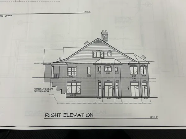 a view of a house with white walls