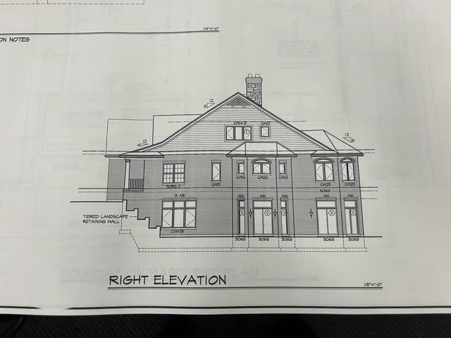 a view of a house with white walls