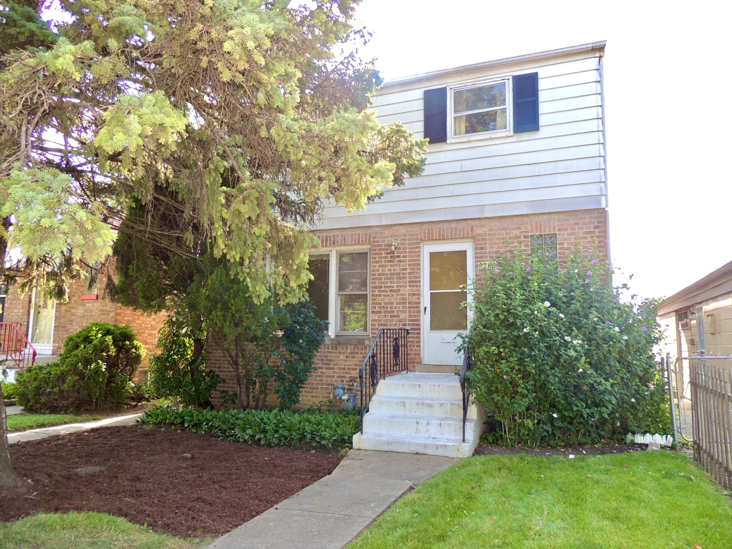 2202 River Road River Grove, IL 60171 - Photo 1 of 33 a front view of a house with garden