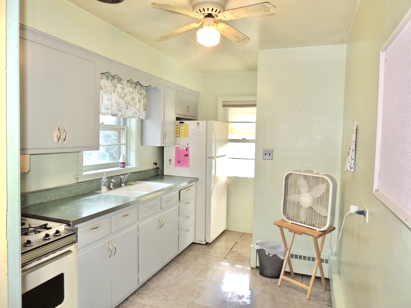 2202 River Road River Grove, IL 60171 - Photo 15 of 33 a kitchen with a sink cabinets and window