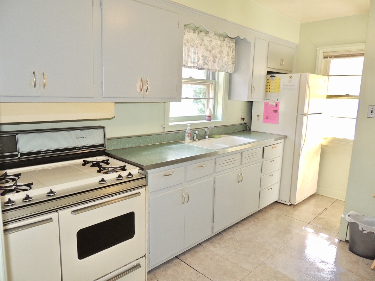 2202 River Road River Grove, IL 60171 - Photo 16 of 33 a kitchen with a stove cabinets and a refrigerator