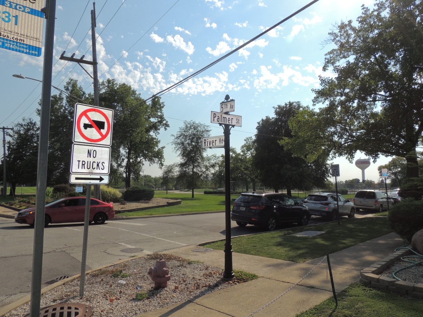2202 River Road River Grove, IL 60171 - Photo 3 of 33 a street sign on a sidewalk next to a road