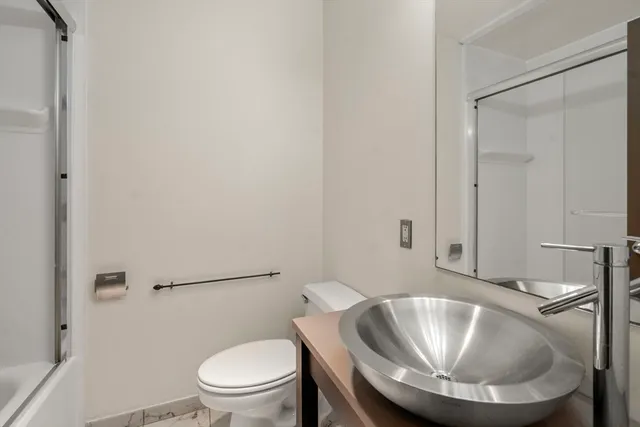 a bathroom with a toilet and a sink