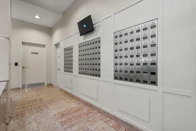 a view of a bathroom with a shower and a sink
