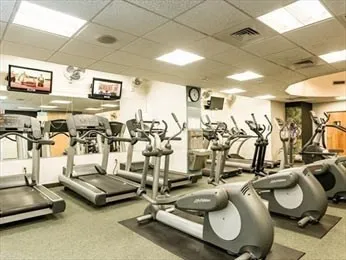 a view of backyard with swimming pool and seating space