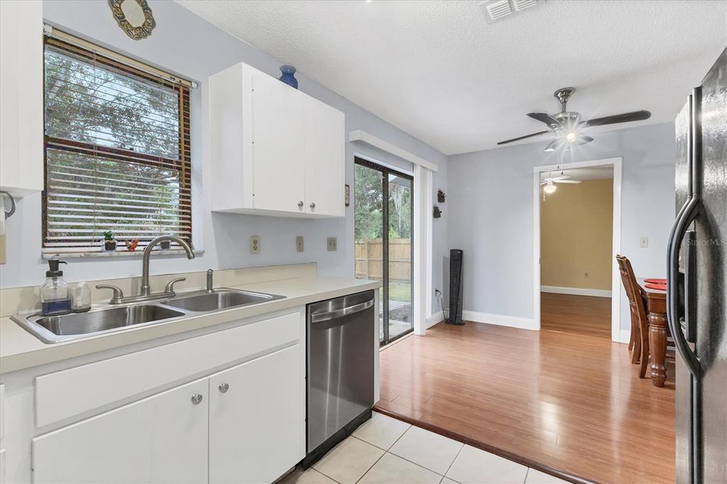 7109 Java Drive Sarasota, FL 34241 - Photo 13 of 23 a kitchen with a sink cabinets and wooden floor