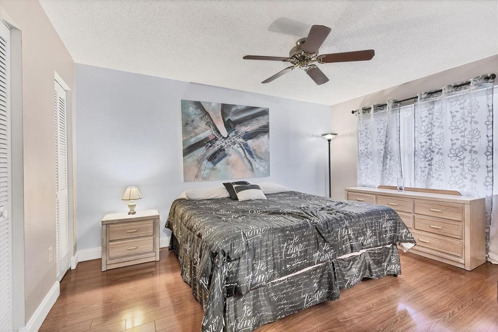 7109 Java Drive Sarasota, FL 34241 - Photo 15 of 23 a bedroom with a bed and a dresser