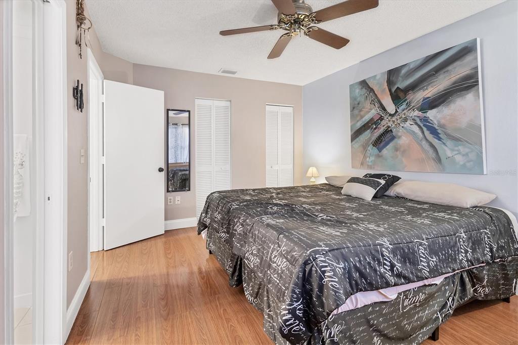 7109 Java Drive Sarasota, FL 34241 - Photo 16 of 23 a bedroom with a bed and wooden floor