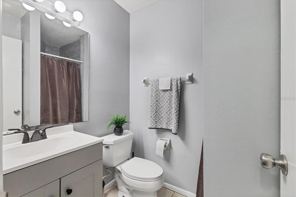 7109 Java Drive Sarasota, FL 34241 - Photo 17 of 23 a bathroom with a sink a toilet and shower