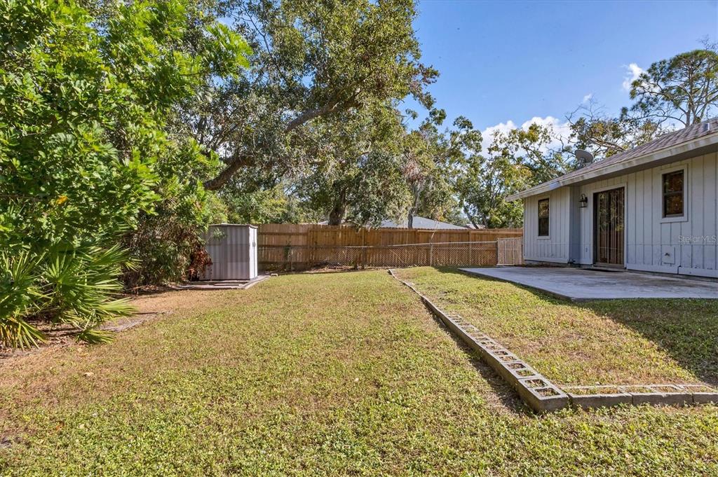 7109 Java Drive Sarasota, FL 34241 - Photo 23 of 23 a view of a backyard with a large tree