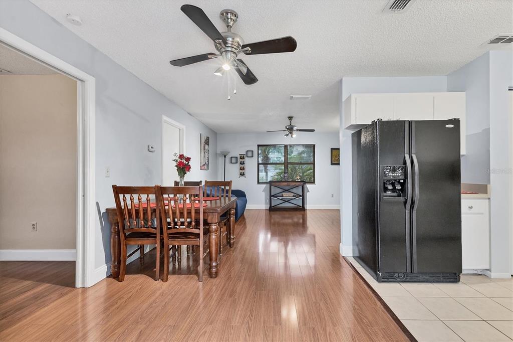 7109 Java Drive Sarasota, FL 34241 - Photo 7 of 23 a dining room with furniture a rug and wooden floor