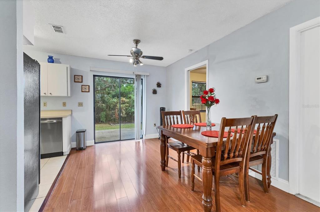 7109 Java Drive Sarasota, FL 34241 - Photo 10 of 23 a view of a dining room with furniture window and wooden floor