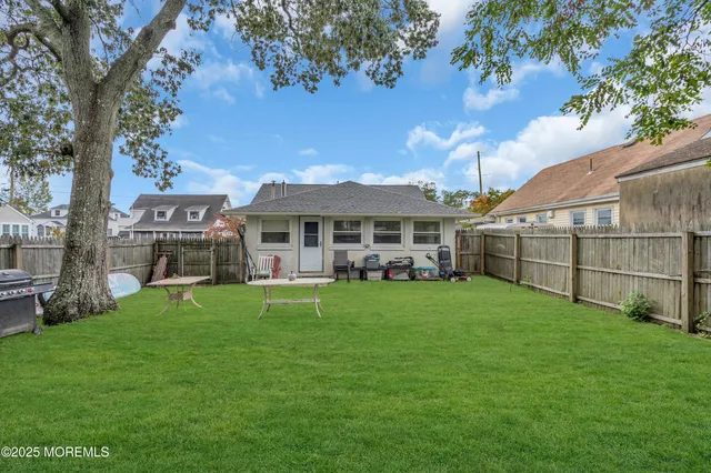 a front view of house with yard and seating area