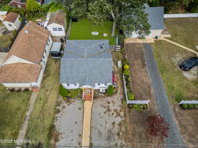 an aerial view of a house with outdoor space