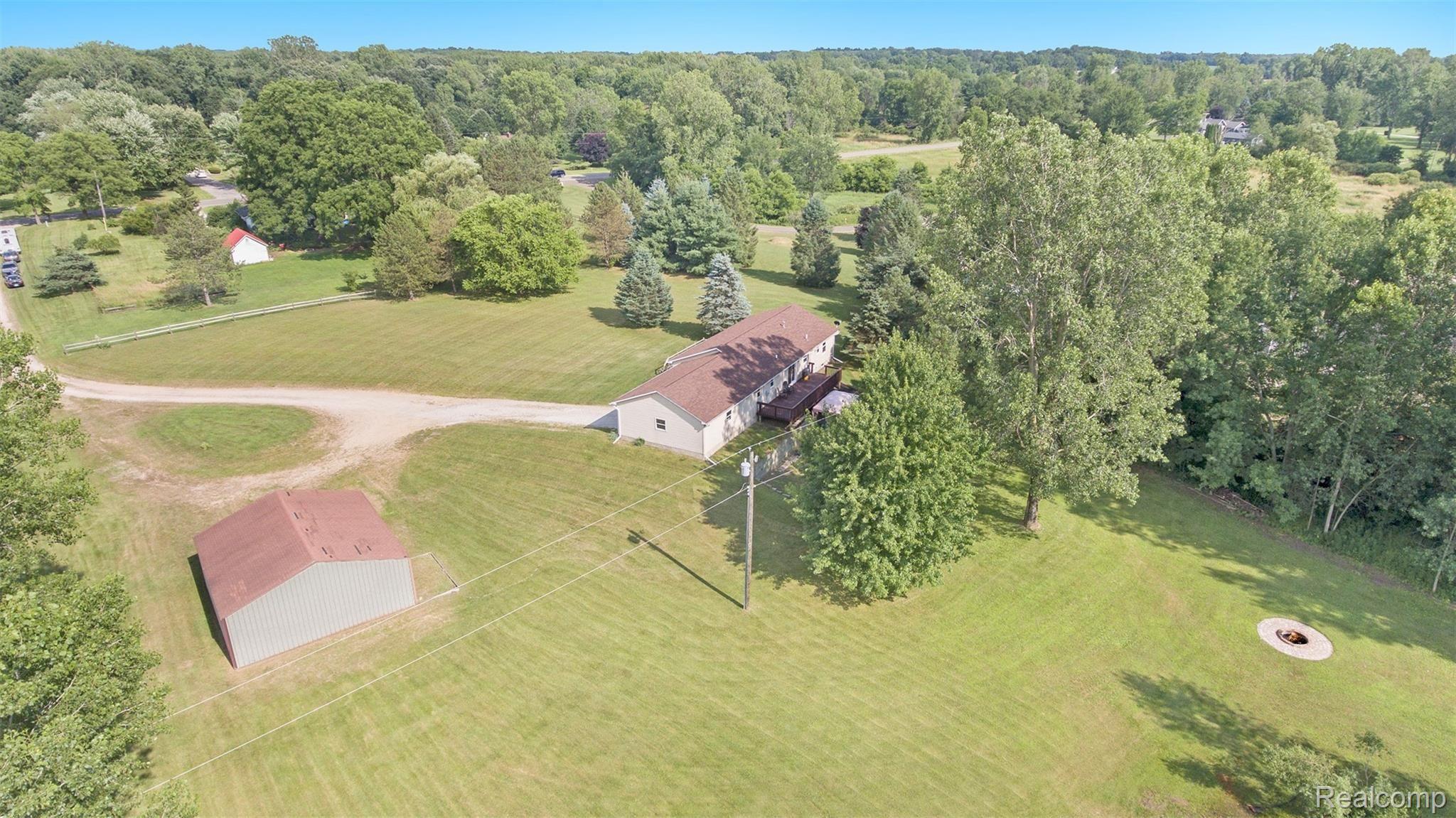 6671 North Fowlerville Road Fowlerville, MI 48836 - Photo 2 of 27 Aerial of back of home