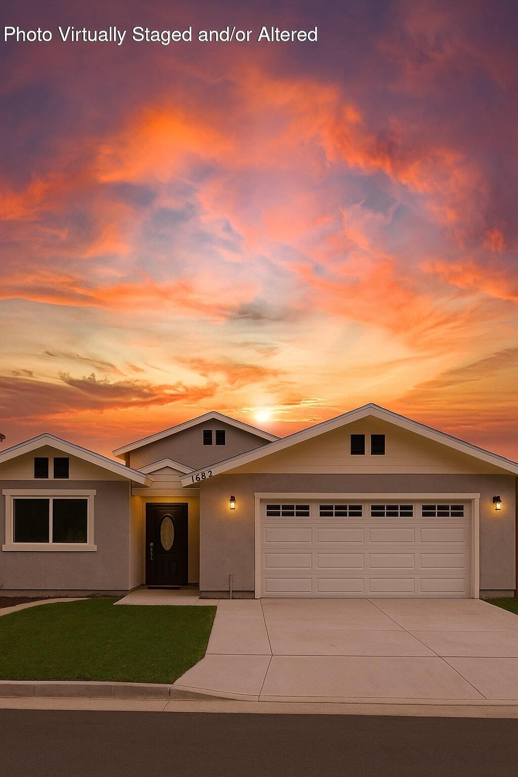 a view of a house with a yard