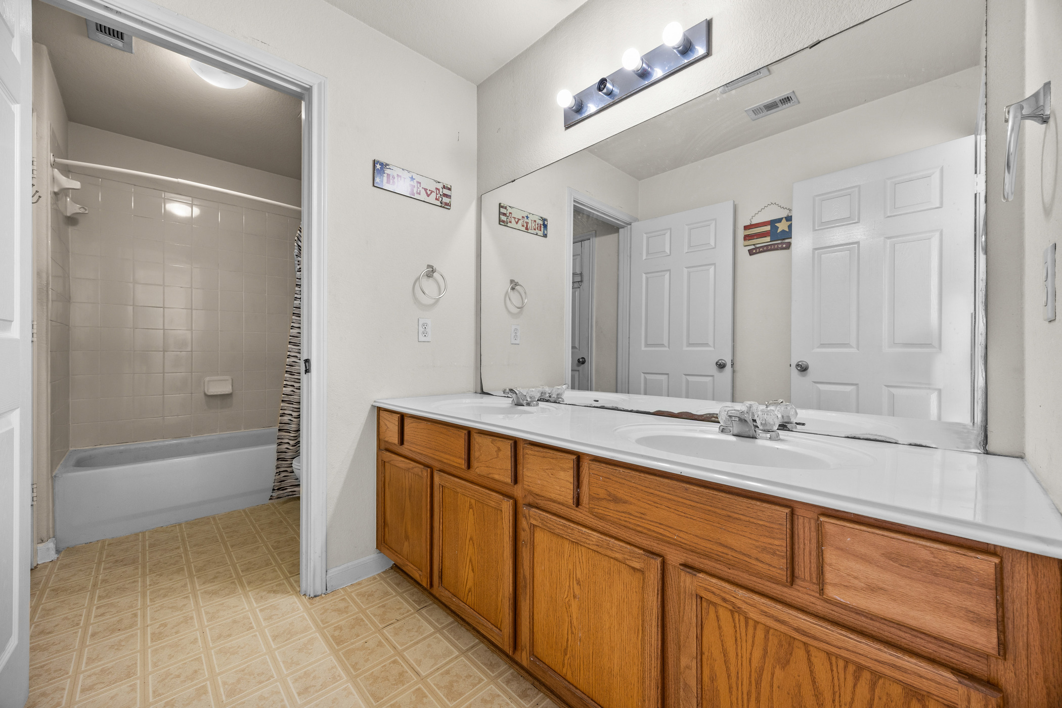 3502 Shiraz Loop Round Rock, TX 78665 - Photo 15 of 23 Full bathroom featuring double vanity and shower / tub combo