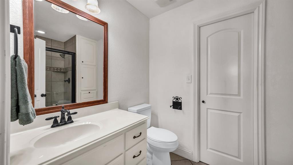 1144 B Boling Ranch North Road Azle, TX 76020 - Photo 21 of 40 a bathroom with a sink a toilet and shower