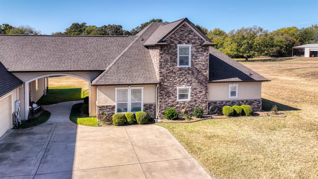 1144 B Boling Ranch North Road Azle, TX 76020 - Photo 25 of 40 a front view of a house with garden