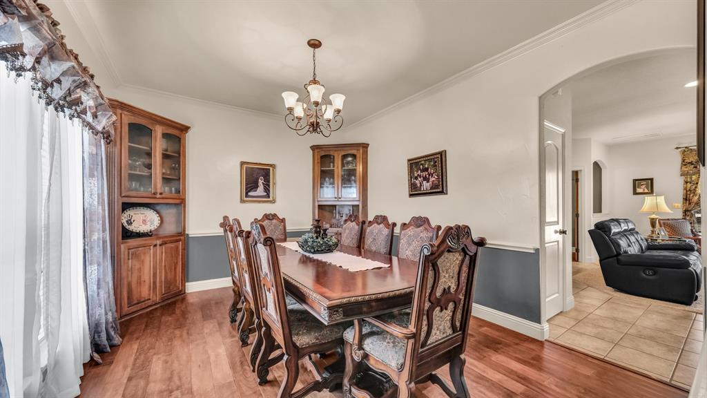 1144 B Boling Ranch North Road Azle, TX 76020 - Photo 30 of 40 a view of a dining room with furniture and wooden floor