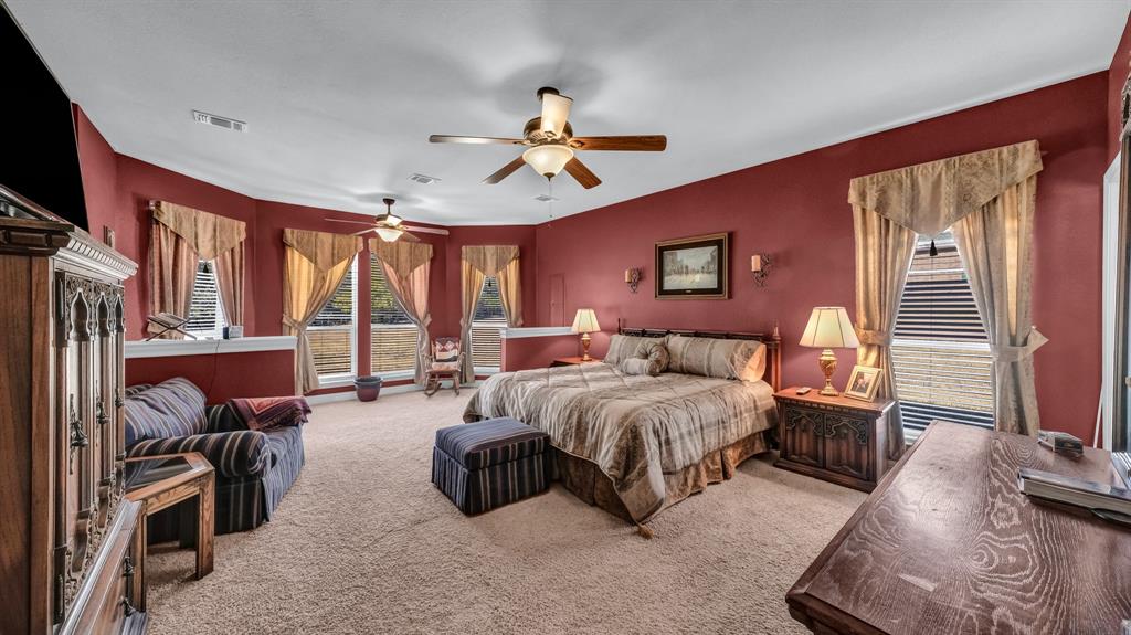 1144 B Boling Ranch North Road Azle, TX 76020 - Photo 31 of 40 a spacious bedroom with bed and a flat screen tv