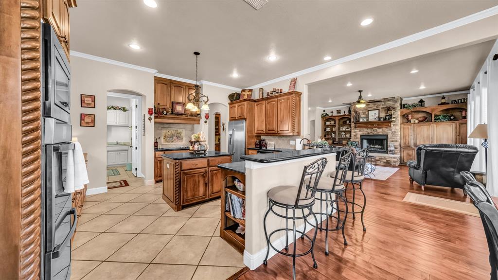 1144 B Boling Ranch North Road Azle, TX 76020 - Photo 4 of 40 a kitchen with stainless steel appliances granite countertop a refrigerator and a stove top oven