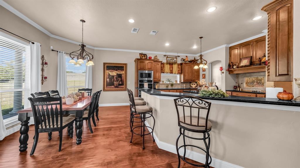 1144 B Boling Ranch North Road Azle, TX 76020 - Photo 8 of 40 a view of a dining room with furniture window and wooden floor